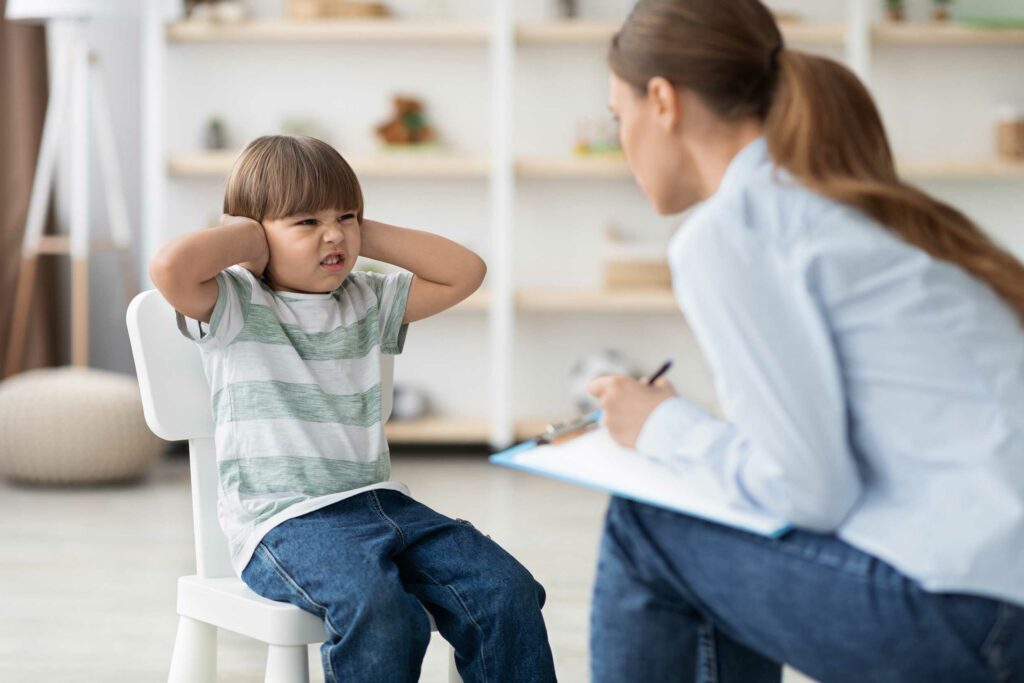 Mother and child participating in ADHD behavioral therapy.