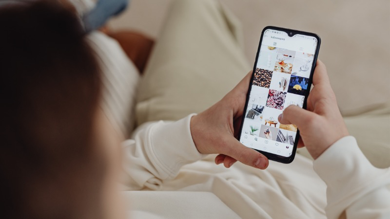 woman scrolling on her phone