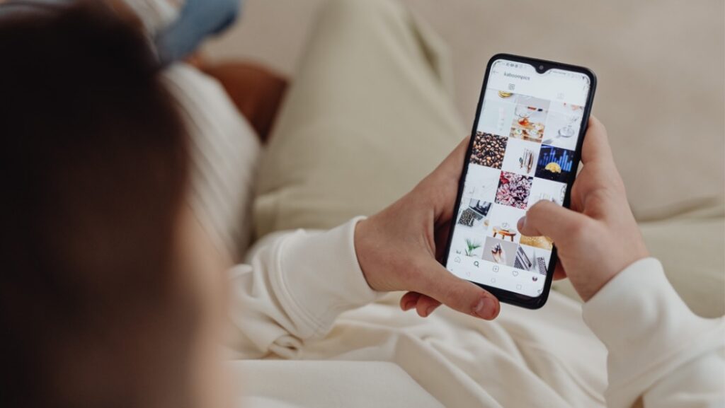 man scrolling on his phone