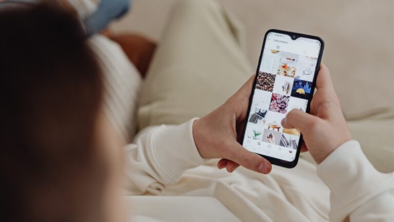 man scrolling on his phone