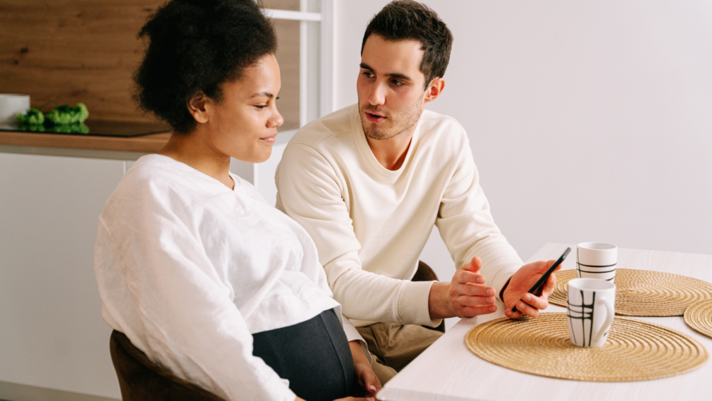couple talking while sitting at a table